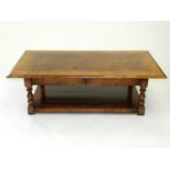 A late 20th Century oak coffee table, of rectangular outline, the moulded top raised on baluster