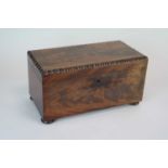 A 19th century mahogany tea caddy, of rectangular form, in flamed veneers, the hinged cover with