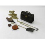 A group of brassware including late 19th Century fire tools and a pair of horse door stops, two