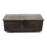 A 17th century and later oak box, 99cm wide (at fault)