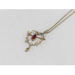 An early 20th century synthetic ruby and seed pearl pendant/brooch
