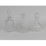 Three cut glass decanters and stoppers, late 20th Century, one of onion form, one of mallet shape