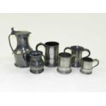 A Victorian pewter quart mug, a pewter pint mug, another 19th century ½ pint mug, another mug, a