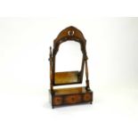 A late Victorian / Edwardian walnut dressing table mirror, the plate within an ogee frame with
