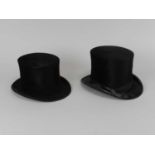 Two silk top hats, the first Battersby & Co., 51.5cm approx., the second Cuthbertson, 53cm