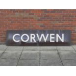 A large enamel railway station sign for Corwen, in white lettering on a dark brown ground, 244cm x