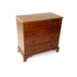 A reproduction walnut chest of drawers, early 20th Century, with four graduated and cock-beaded