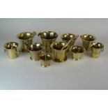 A collection of ten assorted antique cast brass pestles and mortars, of varying age and style, the