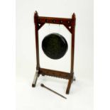 A Victorian, Gothic style, oak hall gong, 111cm high, (2)