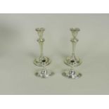 Two pairs of silver mounted candlesticks