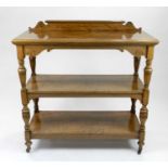 A Victorian figured oak, three-tier buffet, 122cm wide x 56cm deep x 124cm high