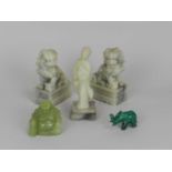 An assembled group of Chinese hardstone figures, 20th Century, including a pair of pale green