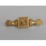 A Victorian Etruscan revival bar brooch