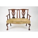 A 19th century, George II style, mahogany two-seater settee, in the style of Chippendale, with