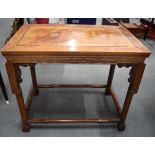 AN EARLY 20TH CENTURY CHINESE HARDWOOD TABLE, formed with carved greek key type decoration to body.