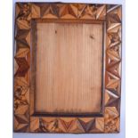 AN UNUSUAL 19TH CENTURY MULTI EXOTIC WOOD INLAID PHOTOGRAPH FRAME. 31 cm x 38 cm.