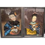 A PAIR OF CHINESE REVERSE PAINTED MIRRORS, depicting a females with pekingese dogs. 48.5 cm x 33 cm.