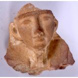 AN EGYPTIAN CARVED STONE HEAD. 13 cm x 12.5 cm.