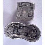 TWO CHINESE WHITE METAL INGOTS, varying form, weight 394 grams. Largest 7.6 cm wide.