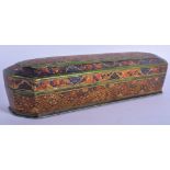 A LARGE 19TH CENTURY INDIAN PERSIAN QAJAR KASHMIR LACQUERED PEN BOX painted with scrolling foliage.