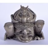 A 1930S JAPANESE TAISHO PERIOD SAMURAI INKWELL formed with a rising dragon helmet. 9 cm x 7 cm.