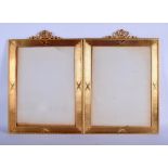 A LARGE PAIR OF EARLY 20TH CENTURY FRENCH GILT METAL MIRRORS. 36 cm x 44 cm.