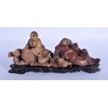 A 19TH CENTURY CHINESE SOAPSTONE FIGURE OF TWO BUDDHA Qing. 22 cm x 9 cm.