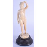 A 19TH CENTURY ANGLO INDIAN BURMESE IVORY FIGURE modelled as a nude female. Ivory 16 cm high.