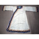 A LATE 19TH CENTURY CHINESE BLUE SILK WORK EMBROIDERED BUTTERFLY ROBE decorated with foliage. 137 cm