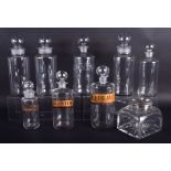 A VICTORIAN SILVER MOUNTED PERFUME JAR together with eight glass bottles. (9)