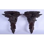 A PAIR OF EARLY 20TH CENTURY BAVARIAN BLACK FOREST WALL BRACKETS. 34 cm x 28 cm.