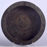 AN 18TH CENTURY ISLAMIC BRONZE DISH, formed with a flared rim and decorated with symbols. 18 cm wid