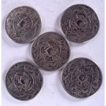 FIVE CHINESE WHITE METAL COINS, decorated with mythical beasts and calligraphy. 4.25 cm wide. (5)