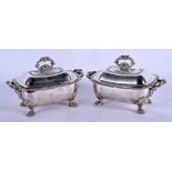 A GOOD PAIR OF REGENCY SILVER PLATED TUREEN AND COVERS with armorial crests. 19 cm x 15 cm.