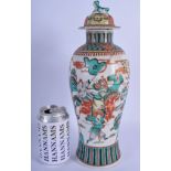 A 19TH CENTURY CHINESE FAMILLE VERTE VASE AND COVER painted with figures. 33 cm high.