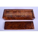 A CASED SET OF BURR WALNUT DOMINOS. 22 cm x 8 cm.