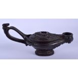 A 19TH CENTURY CONTINENTAL CAST IRON OIL LAMP After the Antique. 13.5 cm wide.