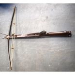 A MID 19TH CENTURY STONE BOW, possibly by Barker of Wigan. With carved walnut stock and folding sigh