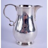 A SILVER CREAM JUG. London 1927. 4.1 oz. 9 cm high.