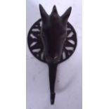 AN ISLAMIC BRONZE COAT HOOK, formed with horse head terminal. 15 cm long.