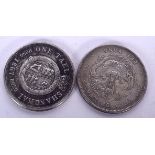 TWO CHINESE WHITE METAL COINS, “One Tael Shanghai”, with another similar. 3.75 cm wide. (2)