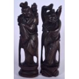 A PAIR OF EARLY 20TH CENTURY CHINESE HARDWOOD SILVER INLAID FIGURES, in the form of a male and femal