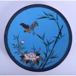 A 19TH CENTURY JAPANESE MEIJI PERIOD CLOISONNE ENAMEL DISH decorated with a bird in flight. 30 cm di