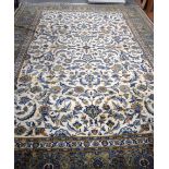 A MASSIVE PERSIAN BEIGE GROUND CARPET RUG, decorated with extensive foliage. 380 cm x 280 cm.