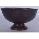 A 19TH CENTURY ISLAMIC BRONZE PEDESTAL BOWL, decorated with script. 21.5 cm wide.