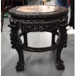 A 19TH CENTURY CHINESE HARDWOOD MARBLE INSET STAND formed with a carved foliate frieze and claw & ba