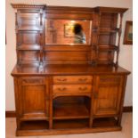 A GOOD ARTS AND CRAFTS SIDEBOARD IN THE MANNER OF SHAPLAND & PETTER BARNSTABLE, inset with mirror an