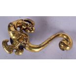 A CHINESE GILT BRONZE BELT HOOK, in the form of a mythical beast, 7 cm wide.