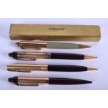 AN EVERSHARP 14CT GOLD PLATED PROPELLING PENCIL together with three others. (4)