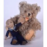 A VINTAGE STEIFF TEDDY BEAR, together with a stuffed sailor. Bear 24 cm. (2)